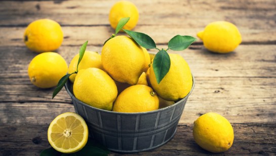 Fresh lemons on the rustic tale