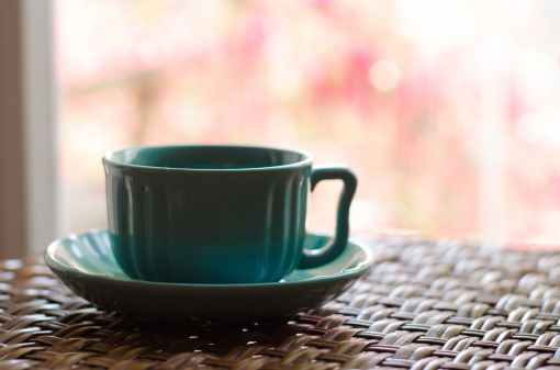 teal ceramic cup and saucer