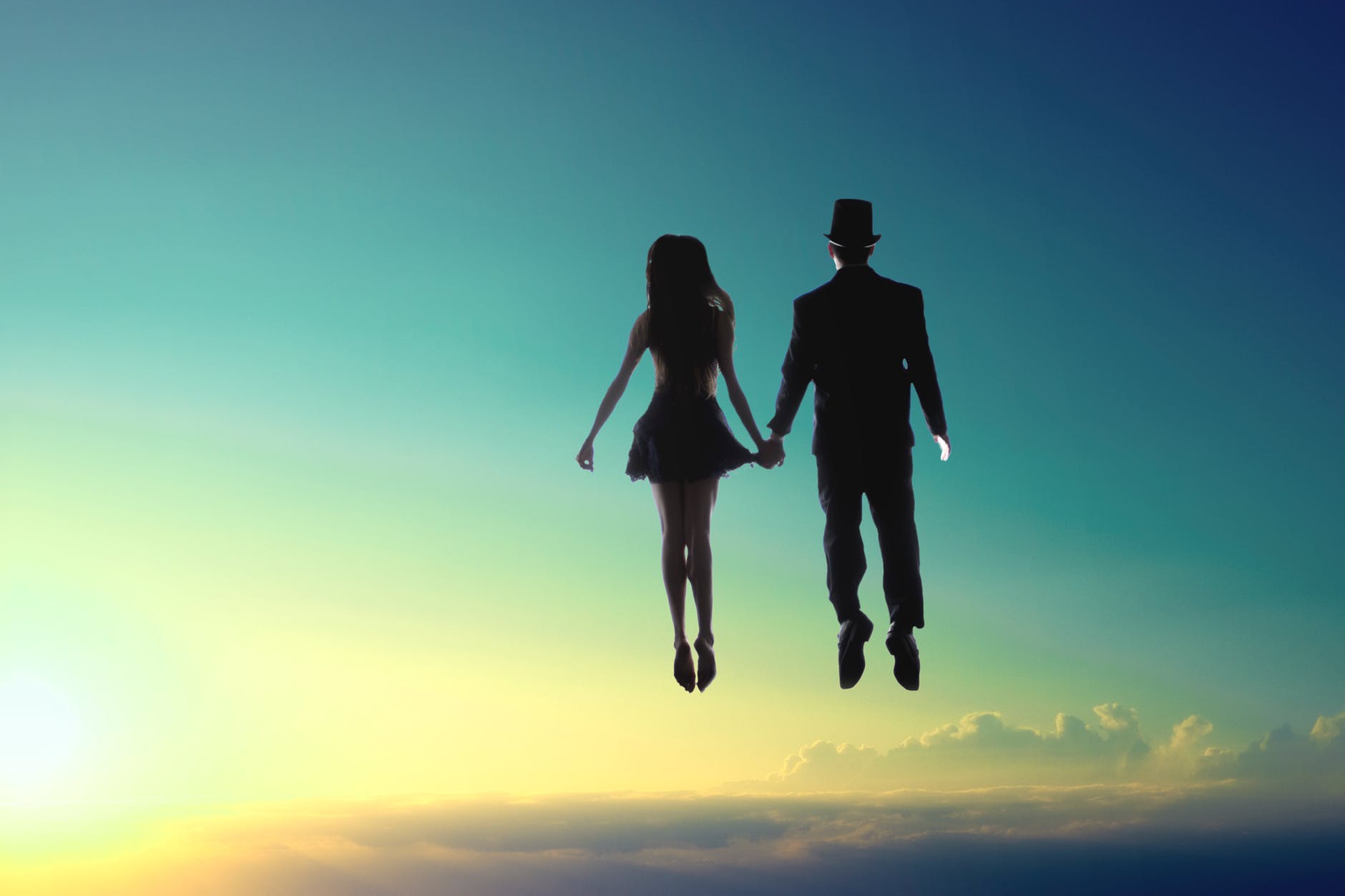 man and woman floating on sky