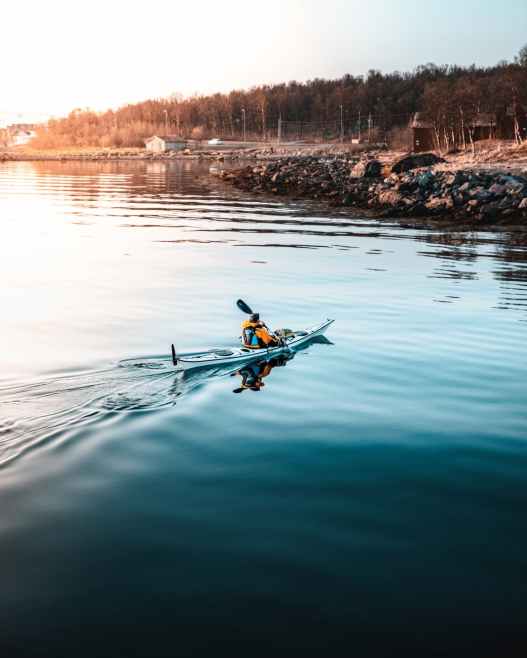 person riding on kayak