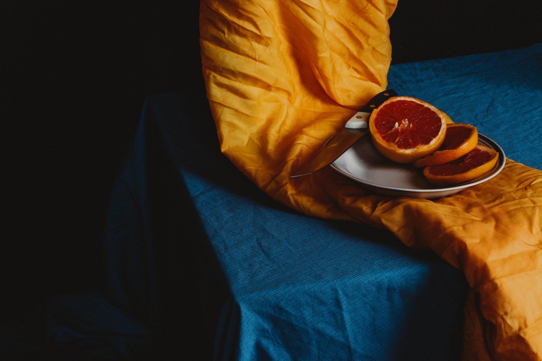 orange fruit on brown round plate
